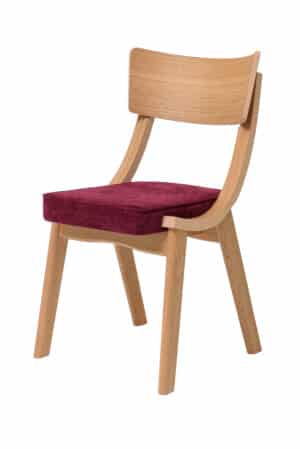 Der Esszimmerstuhl Diran verbindet die natürliche Schönheit massiver Eiche mit einer elegant geformten Rückenlehne und einer bequemen roten Polsterung, die dem Interieur einen markanten Charakter verleiht. Zeitloses Design and hochwertige Verarbeitung machen ihn zu einer stilvollen Ergänzung für jedes moderne und natürlich gestaltete Interieur.